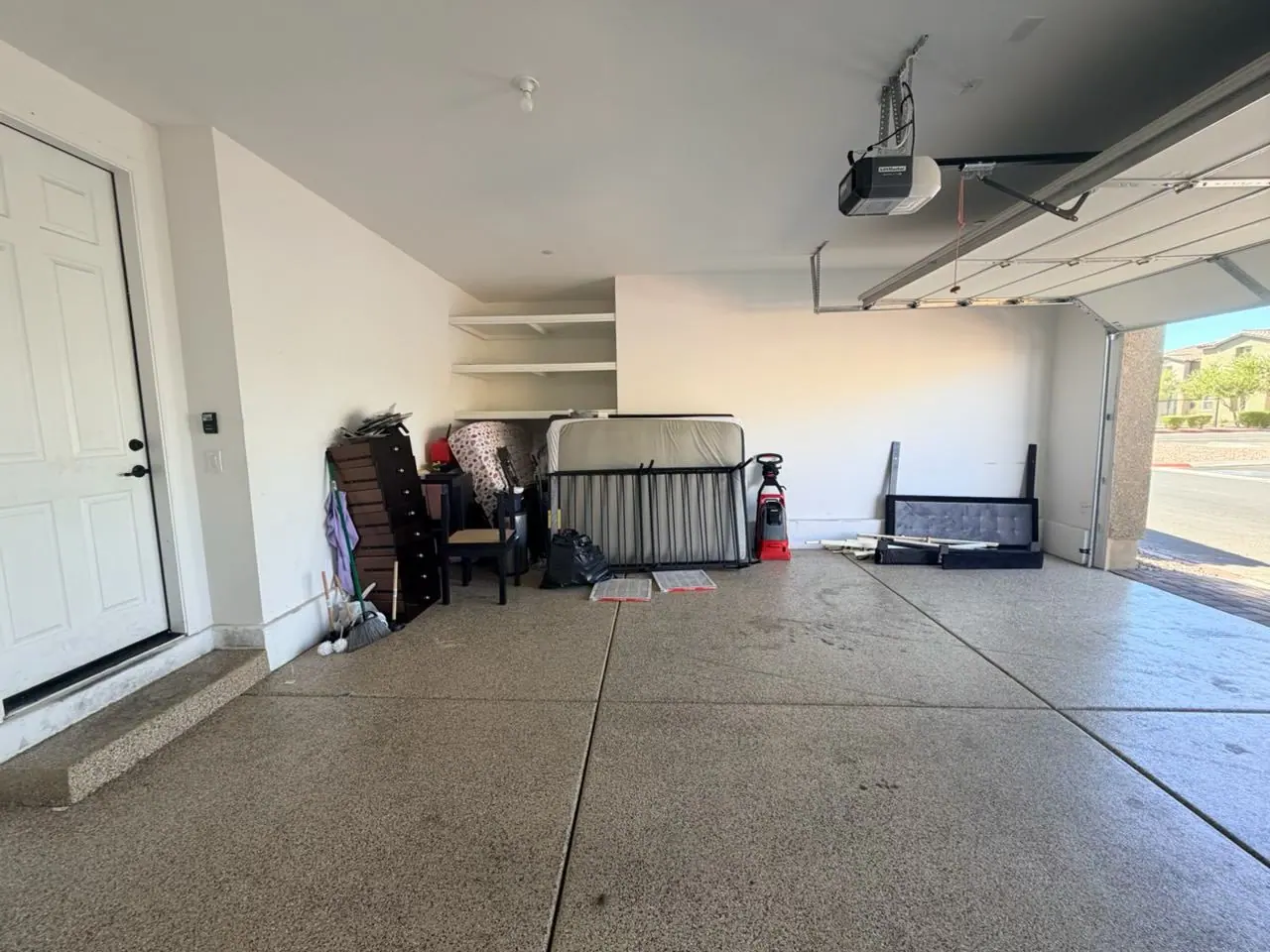 Cadence garage still holding a dresser, bed frame and mattress, and other belongings left behind after an eviction